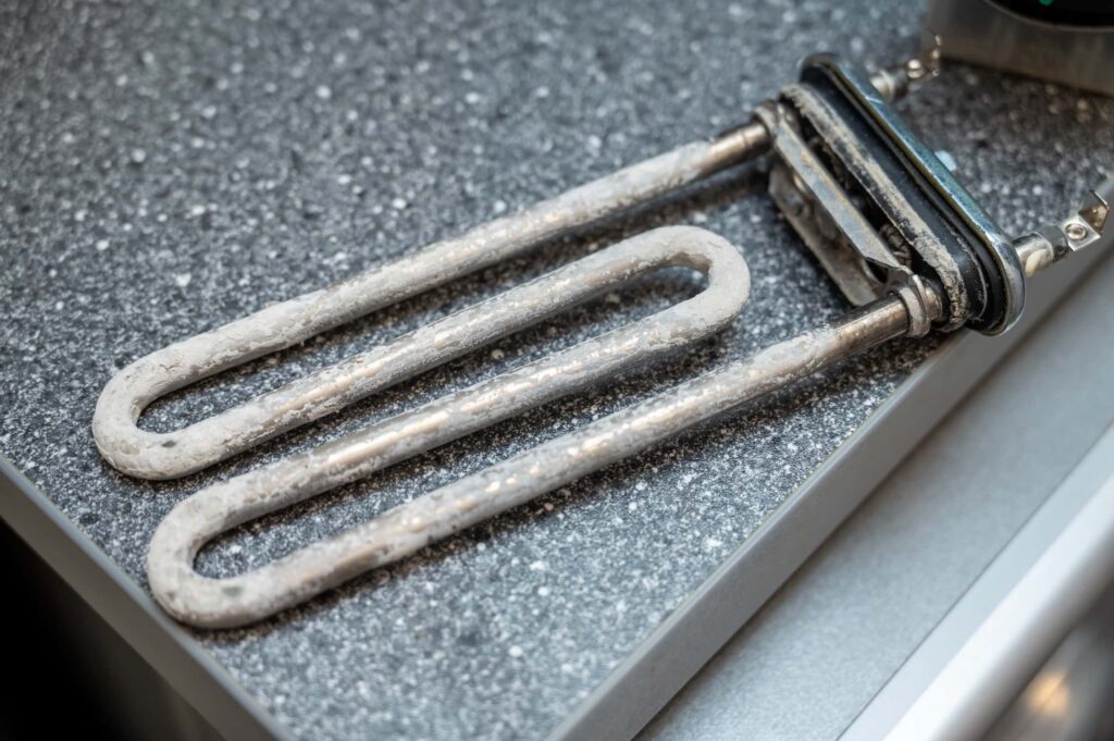 Faulty storage heater element removed from electric heater